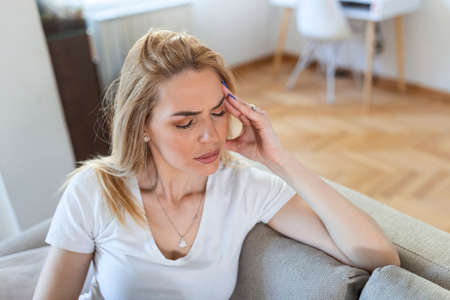 Sinus ache causing very paintful headache. Unhealthy woman in pain. Sharp strong sore. Sinus pain,...