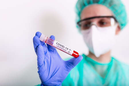 New Epidemic Virus. virus outbreaking. Virus in Lab. Scientist hold tube with Blood Test with the...