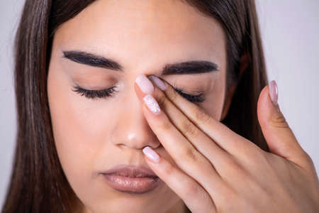 Don't Touch Your Face. Girl rubbing her eye with dirty hands.Precautions, Avoid Touching Your Eyes....