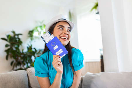 Close up fo woman hand holding passport, boarding pass and corona virus negative test, travel during covid-19 pandemic. It is a time to go to travel in a summer time. journey to holiday vacation tripの写真素材