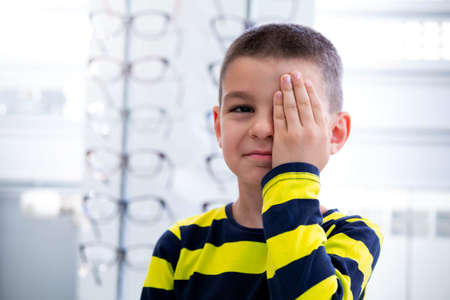 Little boy having eye test at ophthalmologist office.の写真素材