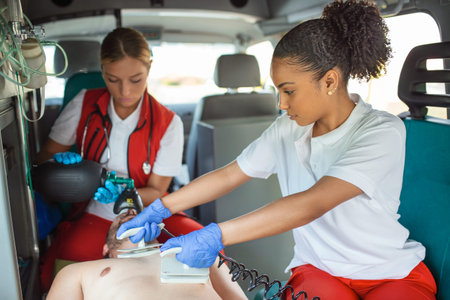 EMS Paramedics Team Provide Medical Help to Injured Patient on the Way to Hospital. Emergency Care...