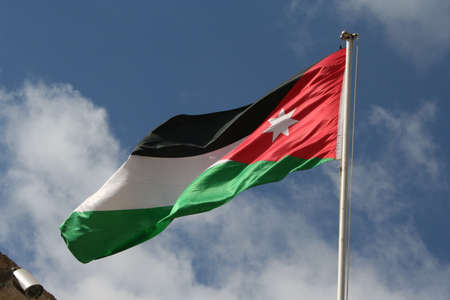 Flag of Jordan waving in the windの写真素材