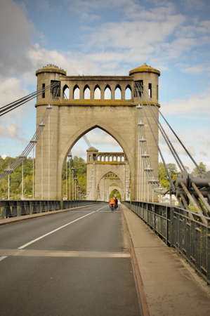 suspension bridge (Langeais - France) on which cyclists cross the Loireの写真素材