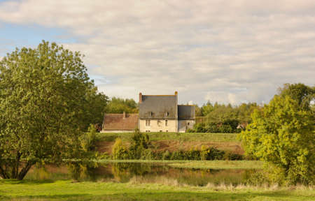 Old tuffeau stone farmhouse by the river Le Cher in Franceのeditorial素材
