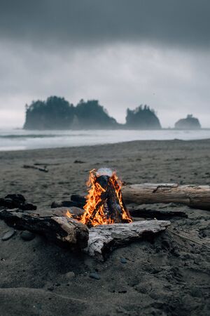 Beach Bonfire on a gloomy PNW evening with Islandsの写真素材