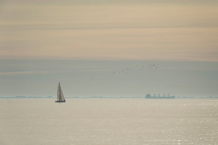 Sailboats on the Atlantic ocean in a warm lightの写真素材