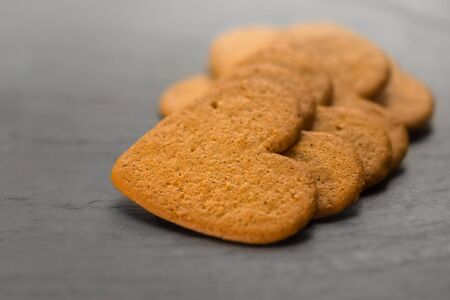 Ginger bread hearts on granite stone - Shallow depth of fieldの写真素材