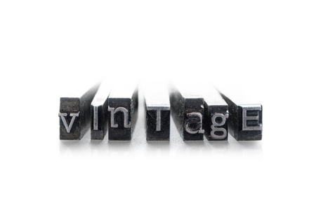 The word  vintage  done in random letterpress type on a white backgroundの写真素材
