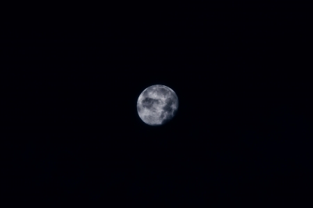 Full moon shines brightly in the nightの写真素材