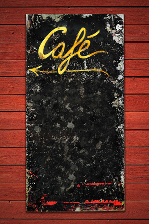 Old coffee sign in weathered metall on a red vintage wall, space for own textの写真素材