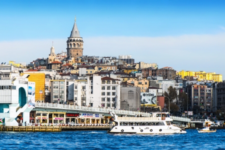 ISTANBUL, TURKEY - NOV 21  View of Istanbul and Galata tower and bridge with ferrys passing in autumn, November 21 in Istanbul, Turkey  Galata Bridge is a symbolic link between Muslim and non-Muslim parts of the cityのeditorial素材