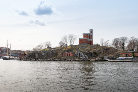 STOCKHOLM - APRIL 12  Kastellholmen from the sea in Stockholm  April 12 2014 in Stockholm, Sweden  Kastellet is a small citadel located on the islet Kastellholmen in central Stockholmのeditorial素材