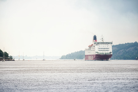 STOCKHOLM, NACKA - JUNE 29: VIKING LINE M/S Mariella trafficking the Stockholm archipelago during a foggy day. June 29, 2014 in Stockholm, Sweden. Goes btween Stockholm and Helsinki, Finland daily.のeditorial素材