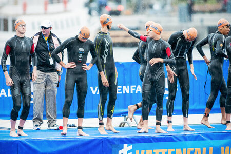 STOCKHOLM - AUG, 23: Triathletes discussing before the start in the mens swimming in the cold water at the Mens ITU World Triathlon Series event Aug 23, 2014 in Stockholm, Swedenのeditorial素材