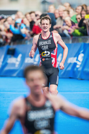 STOCKHOLM - AUG, 23: Alistair Brownlee sees brother Jonathan cross the finish line and win the Mens ITU World Triathlon Series event August 23, 2014 in Stockholm, Sweden. Alistair Brownlee got the second place.のeditorial素材