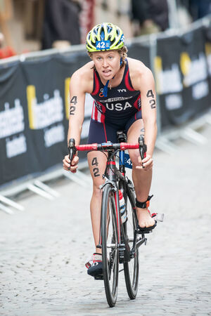 STOCKHOLM - AUG, 23: Chelsea Burns from USA after the transition to cycling at the Womans ITU World Triathlon Series event August 23, 2014 in Stockholm, Swedenのeditorial素材