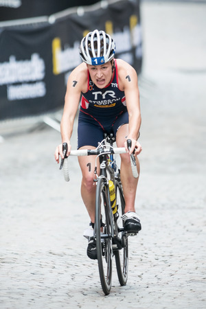 STOCKHOLM - AUG, 23: Jodie Stimpson from Great Britain after the transition to cycling at the Womans ITU World Triathlon Series event August 23, 2014 in Stockholm, Swedenのeditorial素材