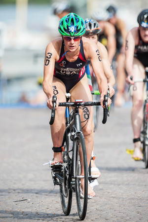STOCKHOLM - AUG, 23: Katie Hursley from USA after the transition to cycling at the Womans ITU World Triathlon Series event August 23, 2014 in Stockholm, Swedenのeditorial素材