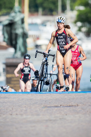 STOCKHOLM - AUG, 23: Sarah Groff from USA running in the transition area to the cycling at the Womans ITU World Triathlon Series event August 23, 2014 in Stockholm, Swedenのeditorial素材