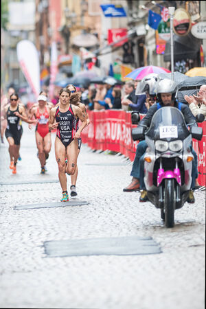 STOCKHOLM - AUG, 23: Sarah Groff from USA leading at the cobblestone roads of the old town in the Womens ITU World Triathlon Series event 23, 2014 in Stockholm, Swedenのeditorial素材