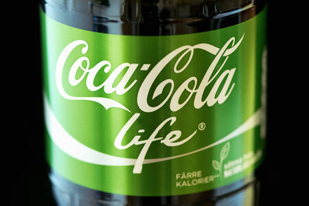 Stockholm, Sweden - Sep 23, 2014: Coca Cola Pet bottle in the new green "Life" edition with lower amount of calories. Coca Cola is one of the worlds bestselling soft drink ever.のeditorial素材