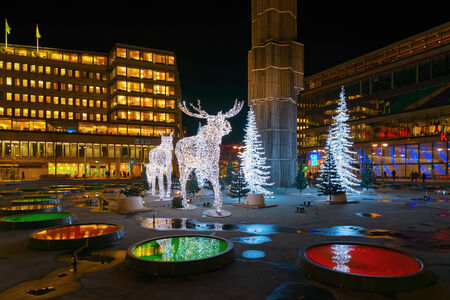 STOCKHOLM - 25 NOV: Christmas decorations in forms of a Moose family in the city centre of Stockholm. 25 November 2014, Sweden. Sergels torg during renovationのeditorial素材