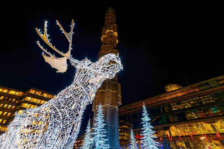 STOCKHOLM - 25 NOV: Closeup of christmas decorations in forms of a Moose in the city centre of Stockholm with the obelisk in background. 25 November 2014, Sweden. Sergels torg during renovationのeditorial素材