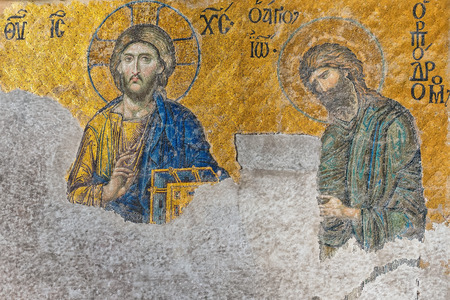 ISTANBUL, NOV 14: Ancient Deesis Mosaic of Jesus Christ (known as Christ Pantocrator) flanked by John the Baptist in the Hagia Sophia museum. November 14, 2013 in Istanbul, Turkeyのeditorial素材