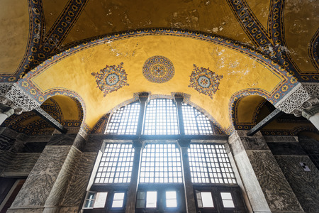 ISTANBUL, NOV 14: Ancient ornaments in the ceiling and big windows in the Hagia Sophia museum. November 14, 2013 in Istanbul, Turkeyのeditorial素材