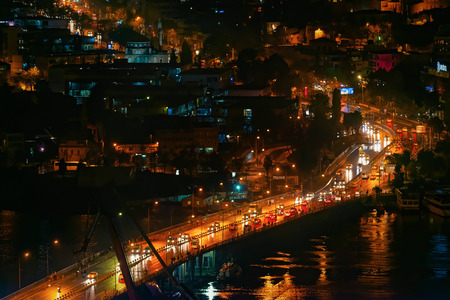 Traffic over the Galata bridge during night time in Istanbul, Turkeyの写真素材