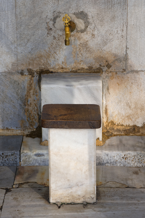 Outside the Blue Mosque in Istanbul, the seats and taps are used for ablutions (washing) before entering the mosque for prayers.の写真素材