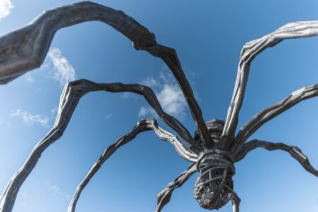 STOCKHOLM, SWEDEN - FEB 25: The sculpture Mama of Louise Bourgoise outside the Moderna Museum in Stockholm, wide angle view from below with sky, February 25 in Stockholm, Sweden. Exhibition of the artist Louise Bourgeois, I have been to hell and back.のeditorial素材