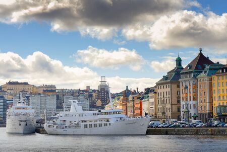 STOCKHOLM, SWEDEN - MAR 31: Slussen and the old town from the seaside with boats and clouds, March 31, 2015 in Stockholm, Sweden.のeditorial素材