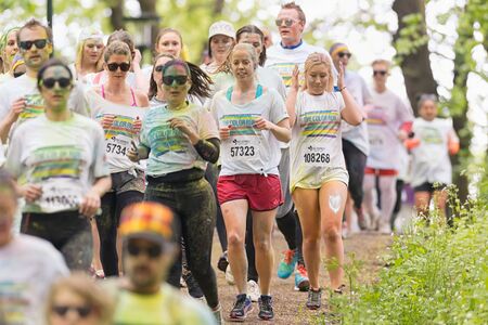 STOCKHOLM, SWEDEN - MAY 23: People running at Stockholm Color Run in Tantolunden or Tanto on May 23, 2015. People from all walks of life participated in the run.のeditorial素材