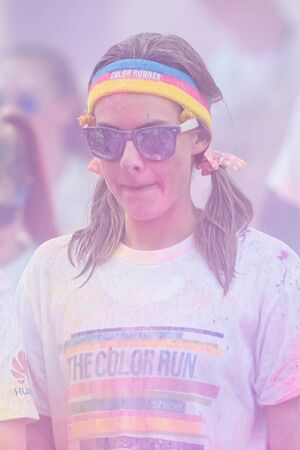 STOCKHOLM, SWEDEN - MAY 23: Woman with colorful fillet at Stockholm Color Run in Tantolunden or Tanto on May 23, 2015. People from all walks of life participated in the run.のeditorial素材