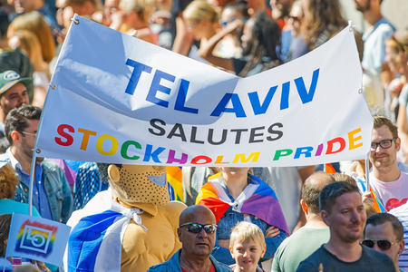 STOCKHOLM, SWEDEN - AUGUST 1, 2015: Banner with the text Tel Aviv salutes Stockholm Pride at the Pride parade in Stockholm. Approx 400.000 spectators at the streets.のeditorial素材