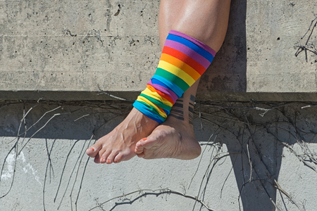STOCKHOLM, SWEDEN - AUGUST 1, 2015: Womans rainbow decorated legs during the Pride parade in Stockholmのeditorial素材