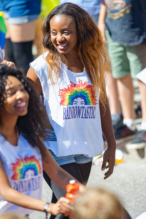 STOCKHOLM, SWEDEN - AUGUST 1, 2015: Two happy girls with a trolley and colorful tshirts at the Pride parade in Stockholm. Approx 400.000 spectators at the streets.のeditorial素材