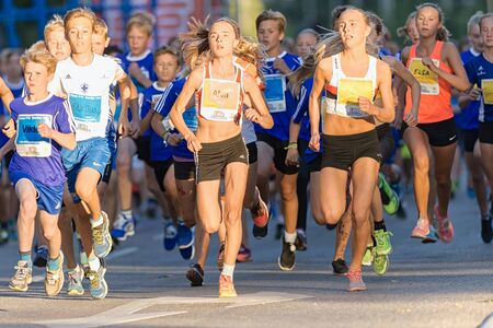 STOCKHOLM, SWEDEN - AUGUST 15, 2015: Start of the midnight run fot teens or Lilla Midnattsloppet for runners aged 13. The track is 1775 meters and the runners are aged 8-15 years.のeditorial素材