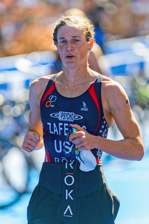 STOCKHOLM - AUG 22, 2015: Katie Zaferes into the transition for cycling at the Womens ITU World Triathlon series event in Stockholm.のeditorial素材