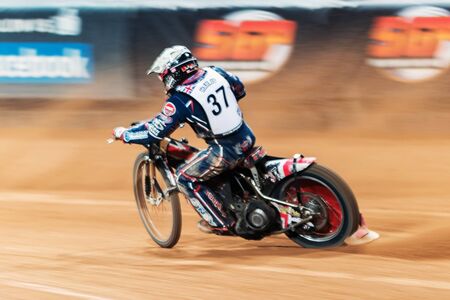 STOCKHOLM - SEPT 26, 2015: Chris Harris from Great Britain in fast speed and motion blur at the TEGERA Stockholm FIM Speedway Grand Prix at Friends Arena in Stockholm.のeditorial素材