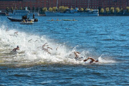 STOCKHOLM, SWEDEN - AUG 22, 2015: Starting grid splashing in the water at the Men's ITU World Triathlon series eventのeditorial素材