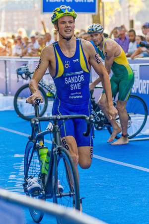 STOCKHOLM, SWEDEN - AUG 22, 2015: Gabriel Sandor from Sweden at the transition in the Men's ITU World Triathlon series eventのeditorial素材