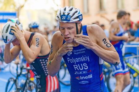 STOCKHOLM, SWEDEN - AUG 22, 2015: Dmitry Polyanskiy from Russia at the transition in the Men's ITU World Triathlon series eventのeditorial素材