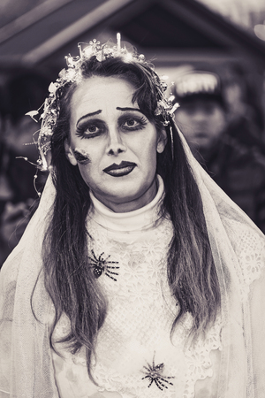 STOCKHOLM, SWEDEN - OCT 31, 2015: Woman in a dead bride costume at Halloween parade Shockholm in Kungstradgarden. Sepia toneのeditorial素材