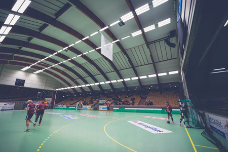 STOCKHOLM, SWEDEN - NOV 4, 2015: Eriksdals arena before the game with some Lugi players warming up before the Handball game between Hammarby vs Lugi at Eriksdalshallen. Allsvenskan Swedish leugueのeditorial素材