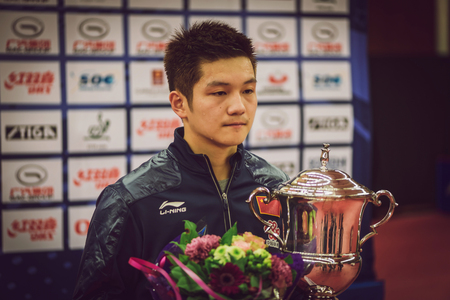 STOCKHOLM, SWEDEN - NOV 15, 2015: Winner Fan Zhendong from China at the podium in table tennis tournament SOC at the arena Eriksdalshallen.のeditorial素材