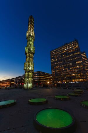 STOCKHOLM, SWEDEN - NOV 4, 2015: Night view of Sergels Torg with the glass obelisk Kristallvertikalaccent. The obelisk by sculptor Edvin Ohrstrom was completed in 1974.のeditorial素材
