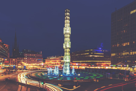 STOCKHOLM, SWEDEN - DEC 27, 2015: Sergels torg with its famous obelisk in the center during night....